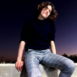 An Evening with Onlyfans Model Leon, Posing Against a Dark Skyline