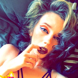 OnlyFans Model Nails Finger on Her Mouth