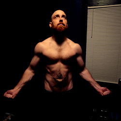 Aaron, a muscular and dedicated fitness model.