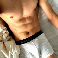 EcoastGL: A Fitness Model Showcasing Abs and Underwear on Bed