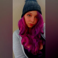 Vividly Styled OnlyFans Model Terësã in a Purple Wig and Beanie Hat
