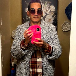 Cool Tattooed Man Taking a Mirror Selfie