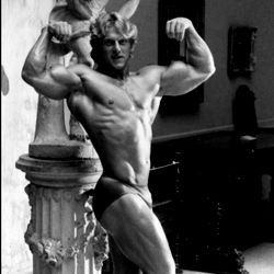 Classic Bodybuilder Statue in Museum Display