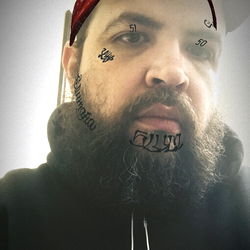 Man with Tattoo Face and Bandana