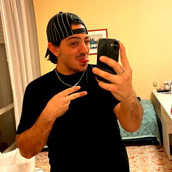 Andrea in a Hotel Room with a Selfie