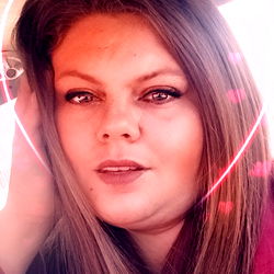 Brittany, the Alabama model with long blonde hair and red lips capturing a moment in her life.