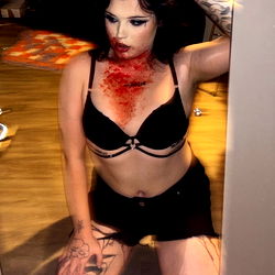 Aria, an OnlyFans model, striking a pose in her boudoir.