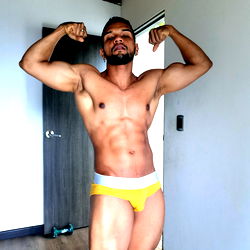 Bodybuilder Alex Walton in a Room, Flexing Muscles