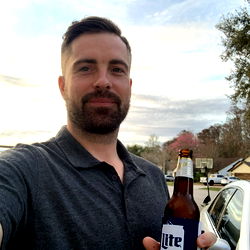 Adagiodenzel on Instagram: Posing with a beer in his hand against an outdoor backdrop