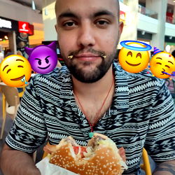 A Young Man Posing with a Cheeseburger