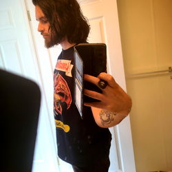 Hipster Emo Guy with Long Hair and Tattoos