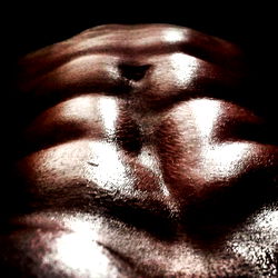 Fit and muscular man showcasing abs