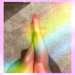 Model Abi Showcasing Rainbow Foot on Carpet