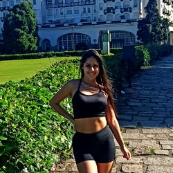 Aline Menezes at a scenic location