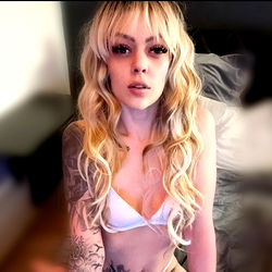 Young Female with Tattoos and Piercings