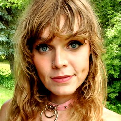 Casually Styled Woman with Pink Hair, Nose Ring and Necklace