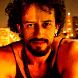 Model posing in a cityscape at night,