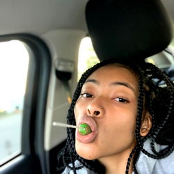 A candid selfie of Virgo, enjoying a lollipop