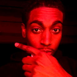 Rapper RA in Red and Black Attire