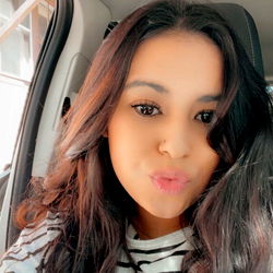 Stylish Allie Grater in a Black and White Photo with Car Door