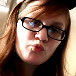 Person in Cat Ears Making a Peace Sign