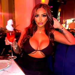 Amelia Sofia, London-based OnlyFans Model Enjoying a Cocktail