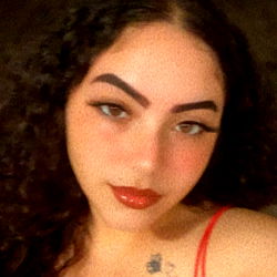 Aria, young woman with striking eyebrows and tattoos