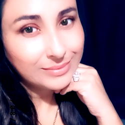 Woman with a radiant smile posing for the camera