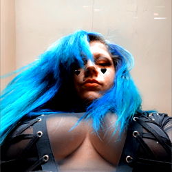 Model in Black and Blue Outfit with Blonde Hair