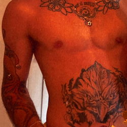 Alstrwnch Model Strikes Pose in Tattooed Style