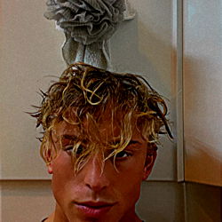 Fit and Muscular Man in Gym Mirror