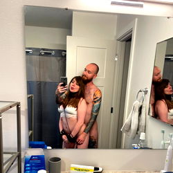 A candid moment of an OnlyFans model and their partner