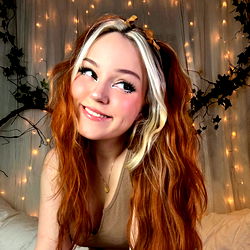 Alice Starr, a Norwegian OnlyFans model with vibrant red hair and captivating eyes