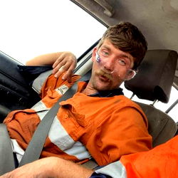 Construction Worker with Injury in Car