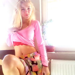 OnlyFans Model Iulia15 in a Chic Pink Outfit and Tie-Dye Skirt