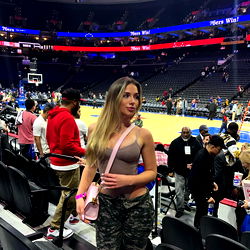 Fans React to Model Photoshoot in Basketball Stadium