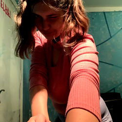 Onlyfans Model Amber: Emotive Moment in Front of Bathroom Mirror