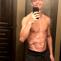 Fit Model Showcasing Physique in Mirror Selfie