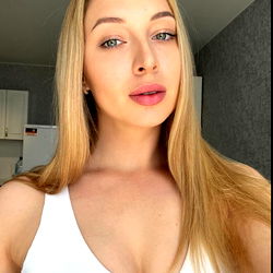 Stylish Young Woman in White Tank Top Taking a Selfie