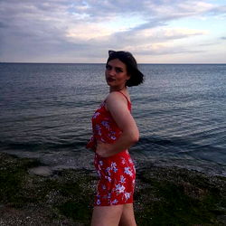 Stylish model posing by the ocean