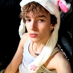 Xavier, a model in a fun pose for OnlyFans