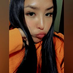 Fashionable Asian Woman in Orange Sweatshirt