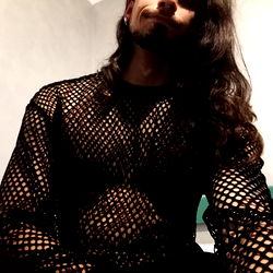 Fashion-forward Instagram model Alexi strikes a pose in unique see-through shirt