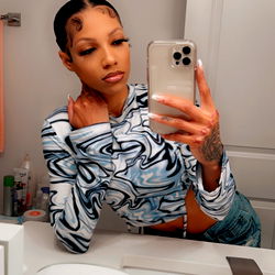 Shardae in a Bathroom Mirror with Phone