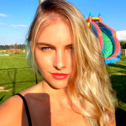 Stylish Model with Short Blonde Hair, Posing Outdoors