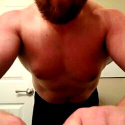 Auburn-haired bodybuilder in a workout room