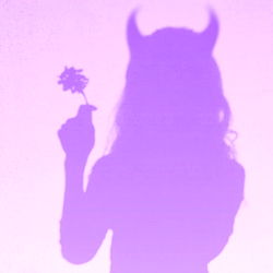 Onlyfans model showcasing devilish spirit with flower