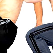 Fitness model JDaredevil showcases strength and balance in a split squat pose.