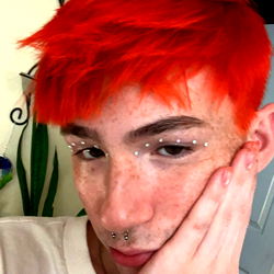 OnlyFans Model Ryro with Bright Red Hair and Striking Makeup