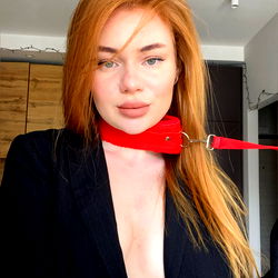 Stunning Model in a Red Blouse and Suit